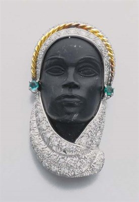 Lot 230 - Carved Ebony, Diamond and Emerald Blackamoor Clip-Brooch