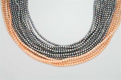 Lot 2188 - Fifteen Strand Coral Bead and Gray Cultured Pearl Torsade Necklace
