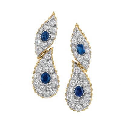 Lot 495 - Pair of Two-Color Gold, Diamond and Sapphire Pendant-Earclips, Buccellati