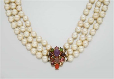 Lot 2189 - Triple Strand Cultured Pearl Necklace with Multi-Colored Stone Clasp