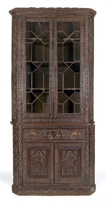 Lot 4217 - Renaissance Style Stained Oak Corner Cabinet...