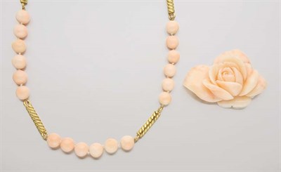 Lot 2658 - Gold and Angel Skin Coral Bead Necklace and Unmounted Carved Coral Flower