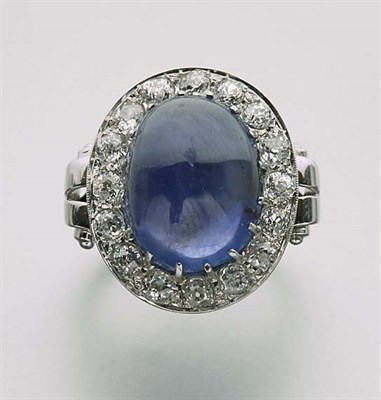 Lot 2314 - Cabochon Sapphire and Diamond Ring