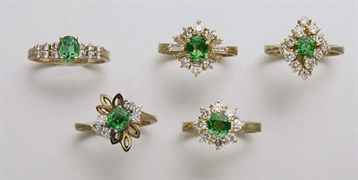 Lot 2422 - Five Demantoid Garnet and Diamond Rings