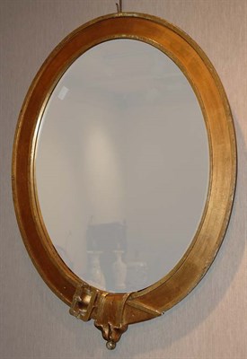 Lot 133 - Gilt-Wood Belt Buckle Decorated Oval Mirror...
