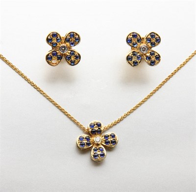 Lot 2375 - Gold, Sapphire and Diamond Flower Pendant-Necklace and Pair of Earrings