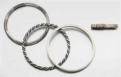 Lot 2779 - Three Sterling Silver Bangle and Tie Tac