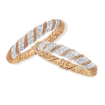 Lot 511 - Pair of Two-Color Gold and Diamond Bangle Bracelets