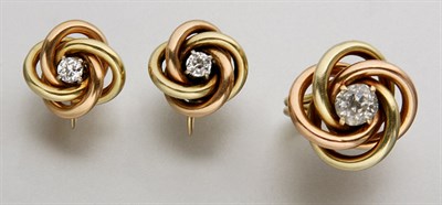 Lot 2504 - Two-Color Gold and Diamond Ring and Pair of Earclips