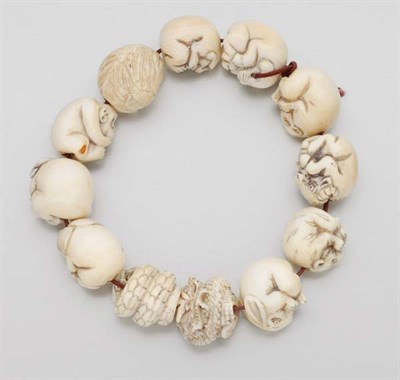 Lot 2436 - Twelve Chinese Zodiac Ivory Beads on String