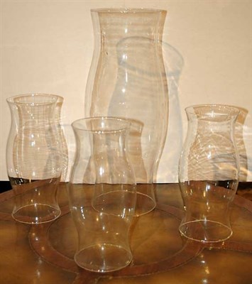 Lot 1214 - Group of Four Colorless Glass Hurricane Shades...