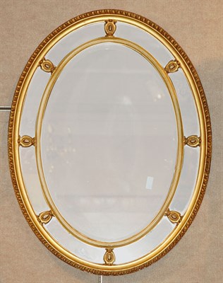 Lot 1447 - Neoclassical Style Gilt-Wood Oval Mirror...