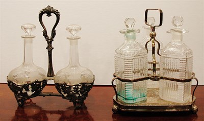 Lot 431 - Two Decanter Sets in Silver Plated Stands...