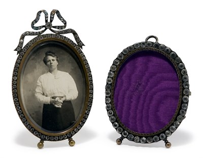 Lot 1084 - Two Metal Photograph Frames Each of oval form,...