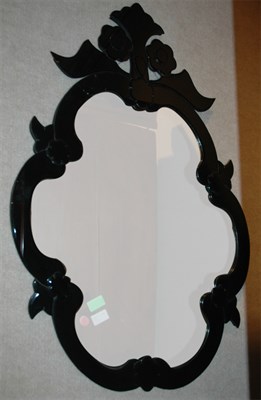 Lot 479 - Black Glass Framed Cartouche-Form Mirror...