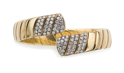 Lot 163 - Gold and Diamond Crossover Bangle, Cartier