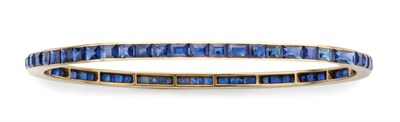 Lot 102 - Gold and Sapphire Bangle