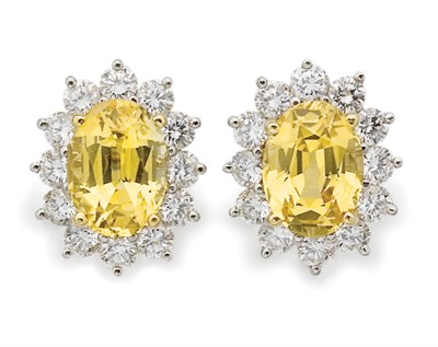 Lot 209 - Pair of Yellow Sapphire and Diamond Earclips, Tiffany & Co.