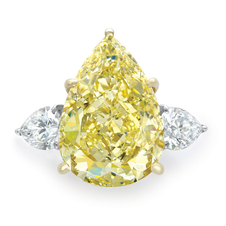 Lot 617 - Fancy Yellow Diamond and Diamond Ring