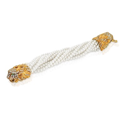 Lot 50 - Thirteen Strand Cultured Pearl Torsade Bracelet with Gold and Diamond Lion Head Clasp