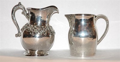 Lot 311 - Two American Sterling Silver Water Pitchers...