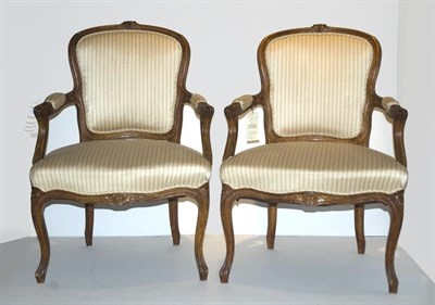 Lot 437 - Pair of Louis XV Style Carved Walnut Fauteuils