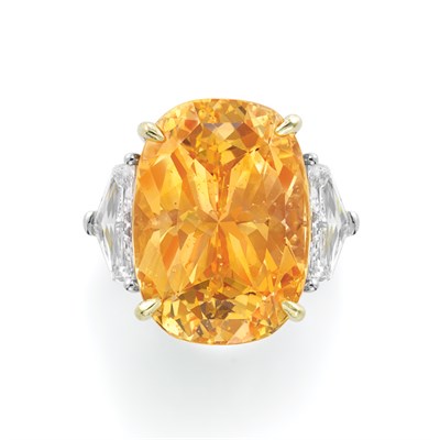 Lot 446 - Orange-Yellow Sapphire and Diamond Ring