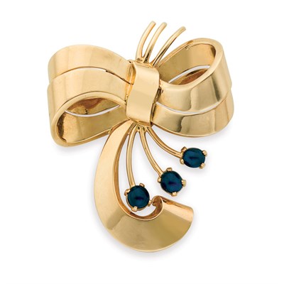 Lot 45 - Gold and Cabochon Sapphire Bow Clip-Brooch