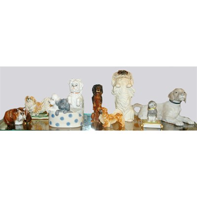 Lot 20 - Group of Nine Porcelain and Pottery Dogs...