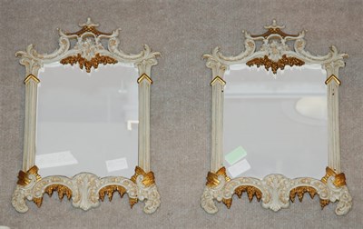 Lot 354 - Pair of Parcel Gilt and White Painted Mirrors...