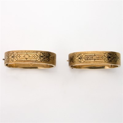 Lot 323 - Pair of Antique Gold and Black Enamel Bangle Bracelets