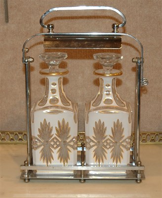 Lot 258 - Chrome Tantalus with Two Cut Glass Decanters...