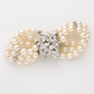 Lot 628 - Triple Strand Cultured Pearl and Diamond Bracelet