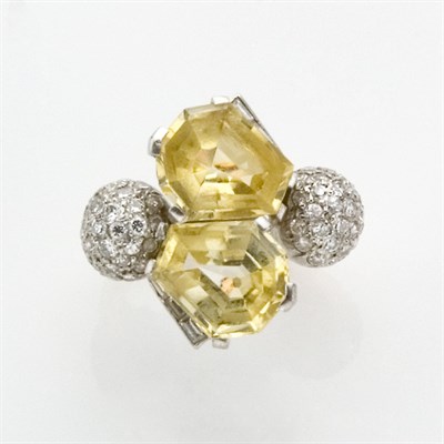 Lot 543 - Rose Gold, Platinum, Yellow Sapphire and Diamond Crossover Ring