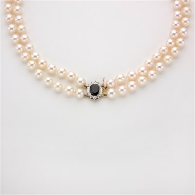 Lot 595 - Double Strand Cultured Pearl Necklace with Sapphire and Diamond Clasp