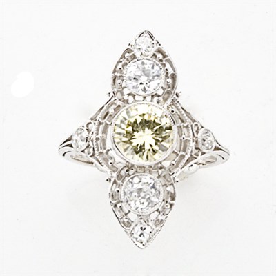 Lot 789 - Fancy Yellow Diamond and Diamond Ring