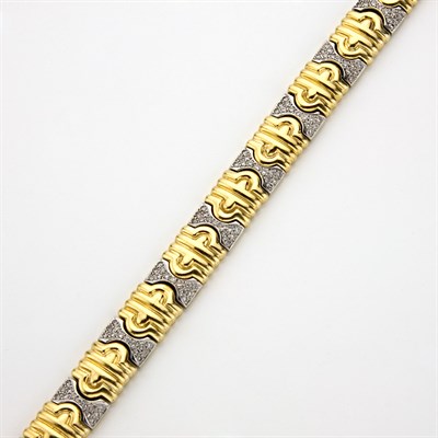 Lot 571 - Two-Color Gold and Diamond Bracelet