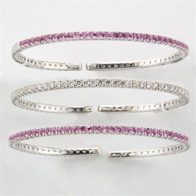Lot 211 - Three White Gold, Diamond and Pink Sapphire Bangle Bracelets