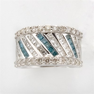 Lot 515 - White Gold, Diamond and Blue Topaz Half-Around Band Ring