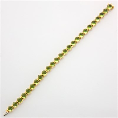 Lot 222 - Gold and Cabochon Peridot Bracelet, Laura Munder