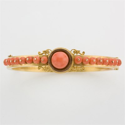 Lot 206 - Antique Gold and Coral Bangle Bracelet