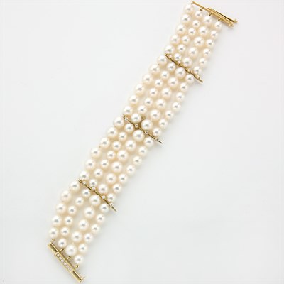 Lot 697 - Four Strand Cultured Pearl, Gold and Diamond Bracelet