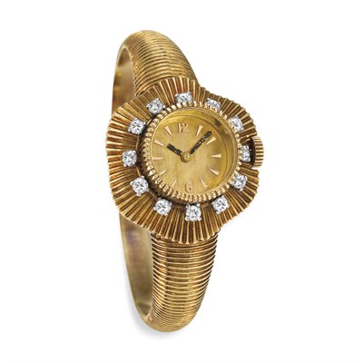 Lot 448 - Gold and Diamond Watch-Bangle Bracelet, Boucheron