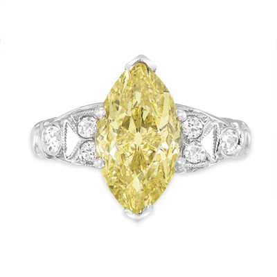 Lot 517 - Fancy Intense Yellow Diamond and Diamond Ring