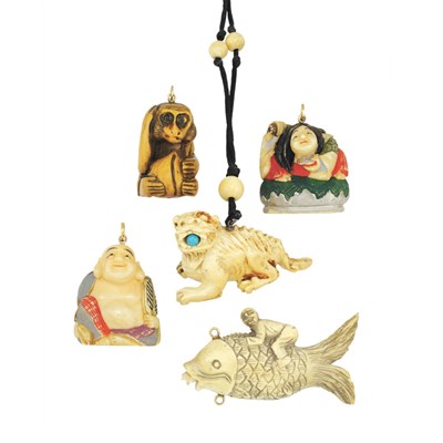 Lot 558 - Assorted Group of Carved Ivory and Bone Pendants