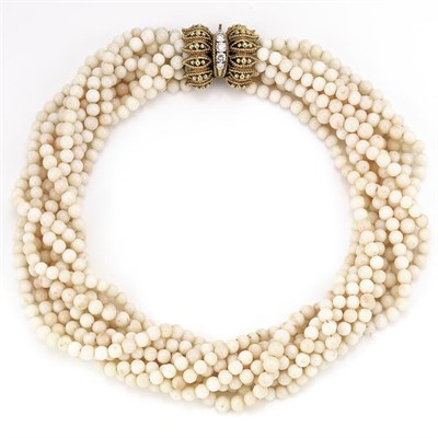 Lot 395 - Nine Strand Angel Skin Coral Bead Torsade Necklace with Gold and Diamond Clasp