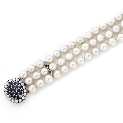 Lot 186 - Triple Strand Semi-Baroque Cultured Pearl and Sapphire Bracelet