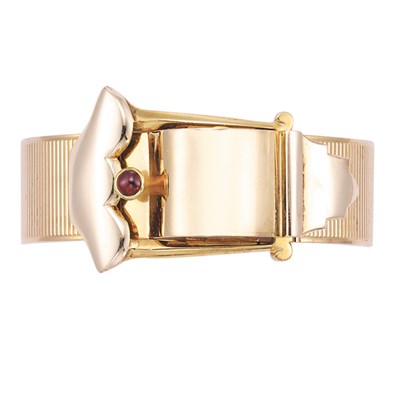 Lot 477 - Gold and Cabochon Ruby Buckle Bangle-Watch Bracelet, Tiffany & Co.