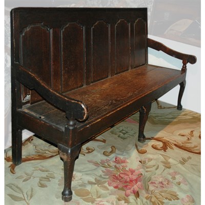 Lot 302 - Provincial George II Oak Settle The paneled...