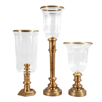 Lot 576 - Group of Three Brass and Glass Hurricane Lamps...